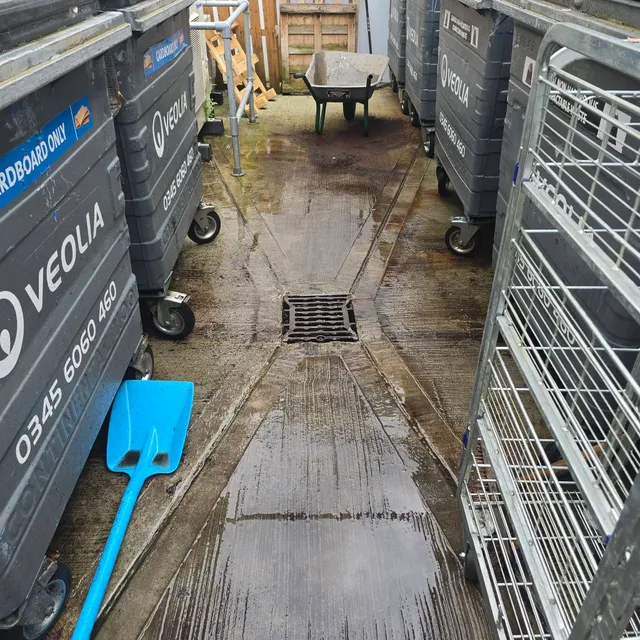 Clear, flowing drain and dry yard at Starbucks Arden, Glasgow after high pressure water jetting